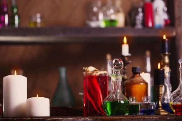 A table with some bottles and candles on it